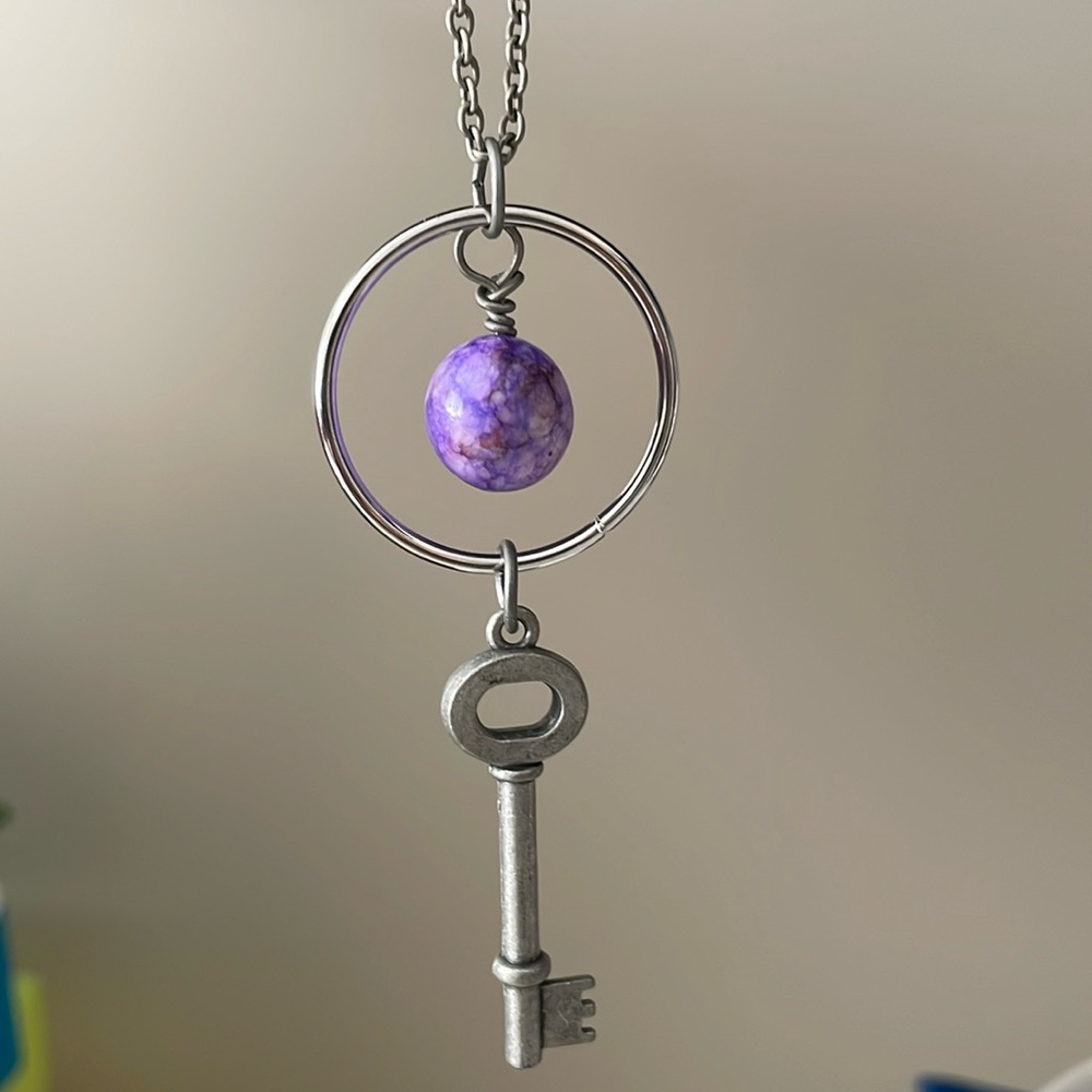 Purple gemstone with key necklace